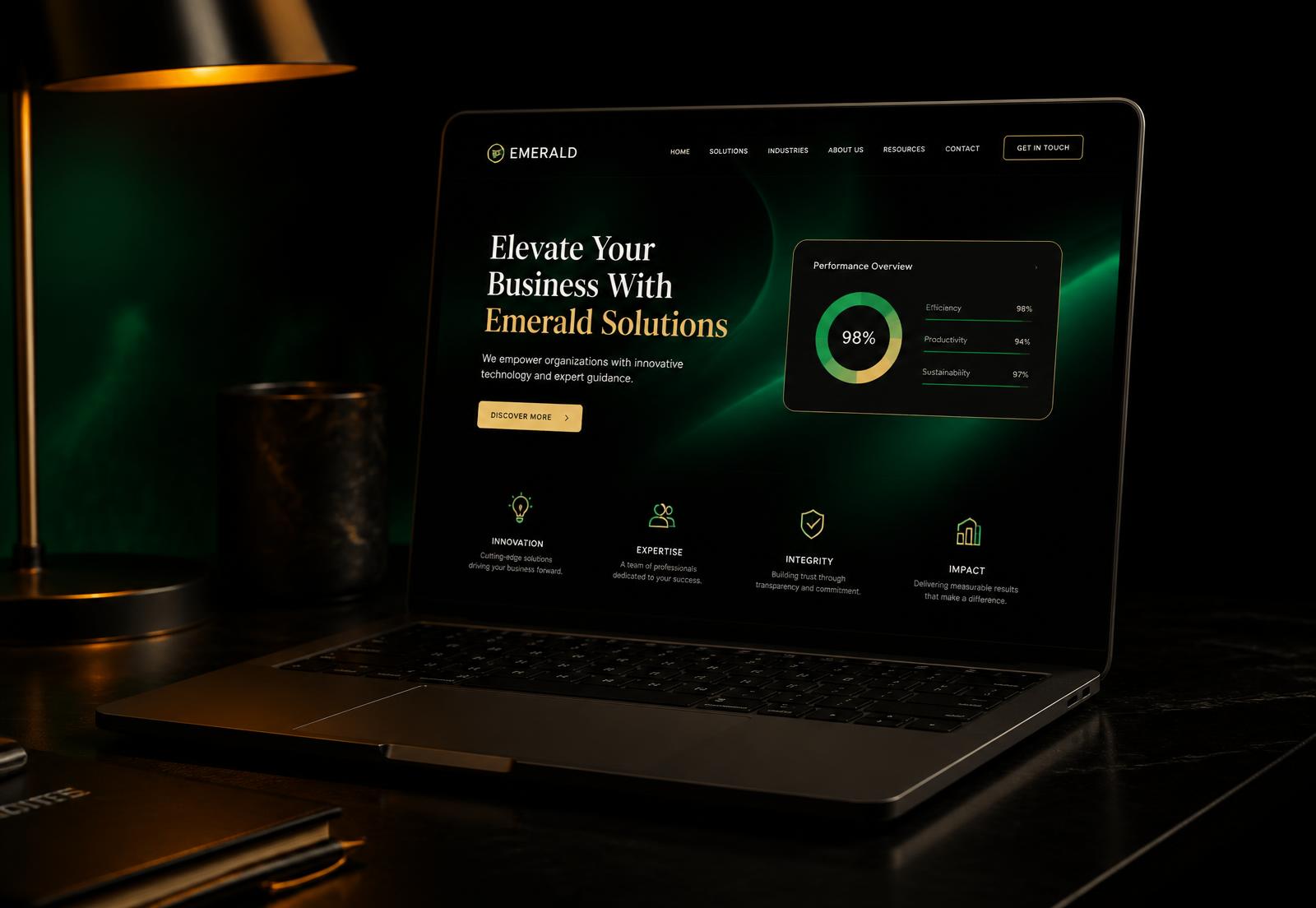 Luxury dark website design displayed on a laptop with emerald and gold accents